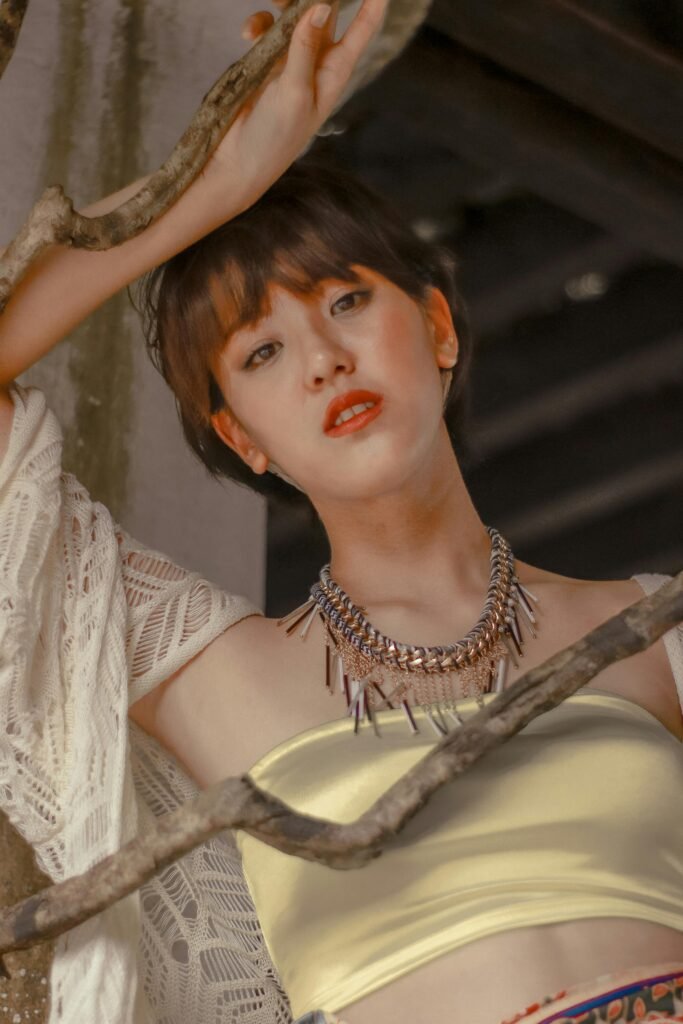 Elegant portrait of a woman with jewelry in an urban Kuala Lumpur setting.